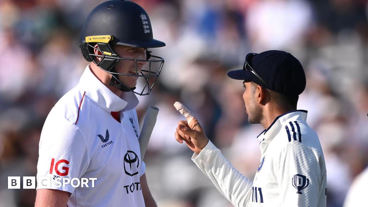 Sarina Wiegman looks forward with a fixed expression