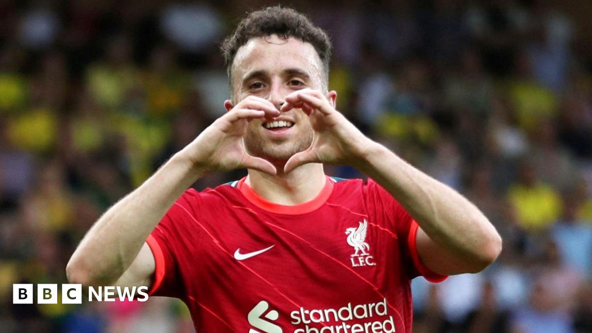 A mid-shot of Diogo Jota with his hands in the shape of a heart.