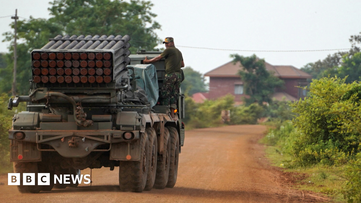 Cambodian military personnel stands on a multiple rocket launcher around 40 km (24 miles) from disputed territory with Thailand