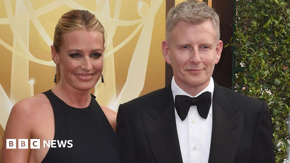 Cat Deeley and Patrick Kielty pose in front of a yellow background.