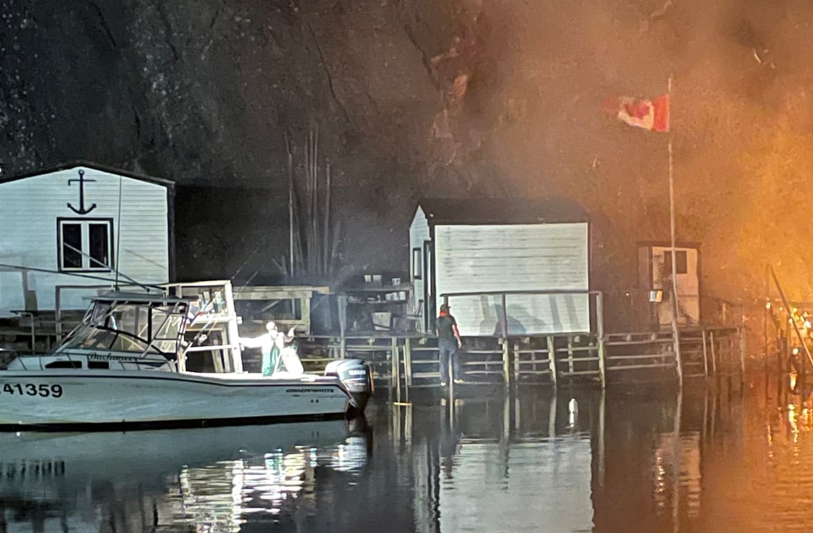 A close up of a boat next to a wharf