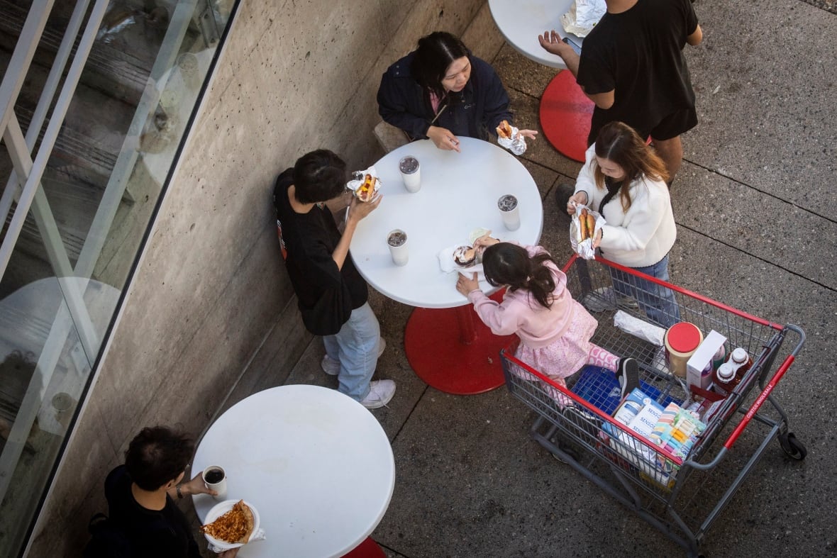 People eat  outside in an aerial photo