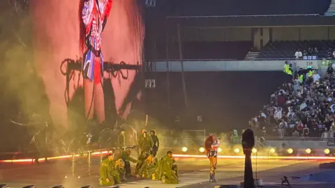 SZA in a red, white and blue outfit