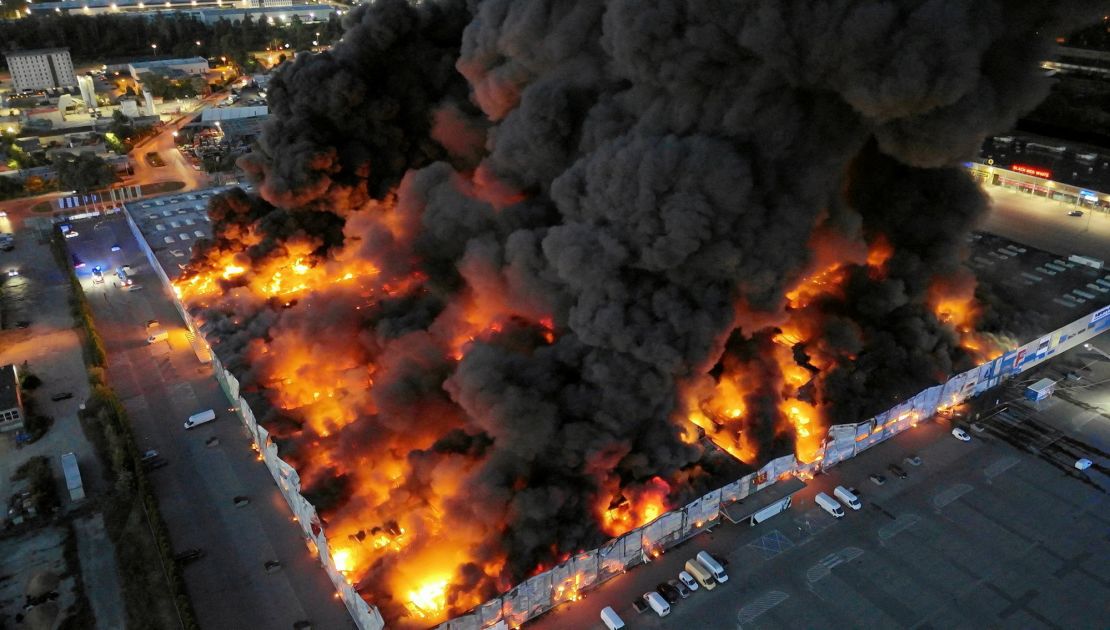 A drone view of the Marywilska 44 shopping centre burning during a massive fire in Warsaw, Poland, on May 12, 2024.