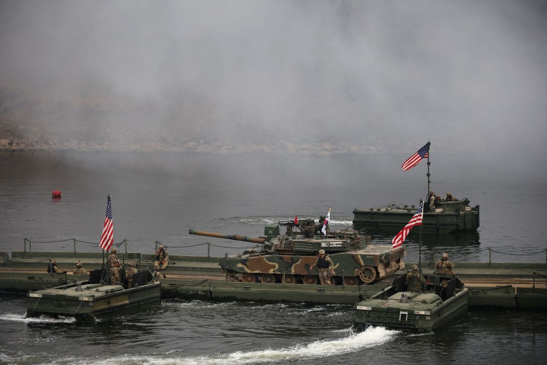 A South Korean army tank is moved on a pontoon bridge during a US-South Korea joint river-crossing exercise which is a part of the annual Freedom Shield joint military training, near the demilitarized zone separating the two Koreas in Yeoncheon, South Korea, March 20, 2025.