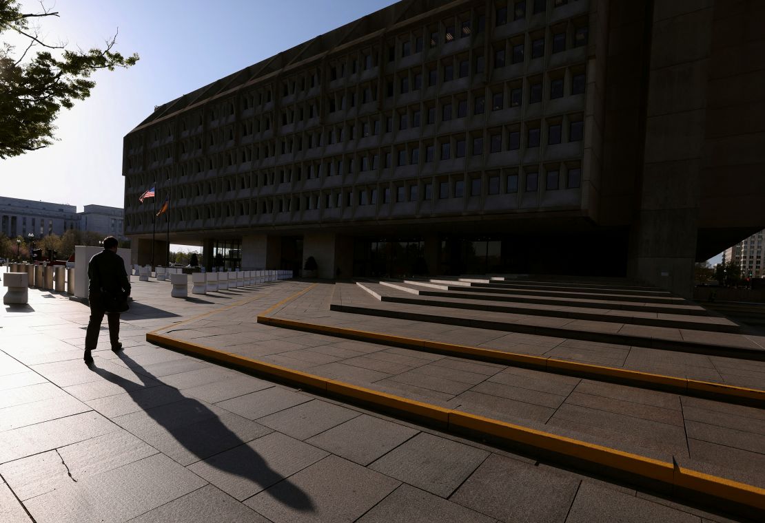 A man walks toward the headquarters of the Department of Health and Human Services (HHS) in Washington, DC, April 1, 2025.