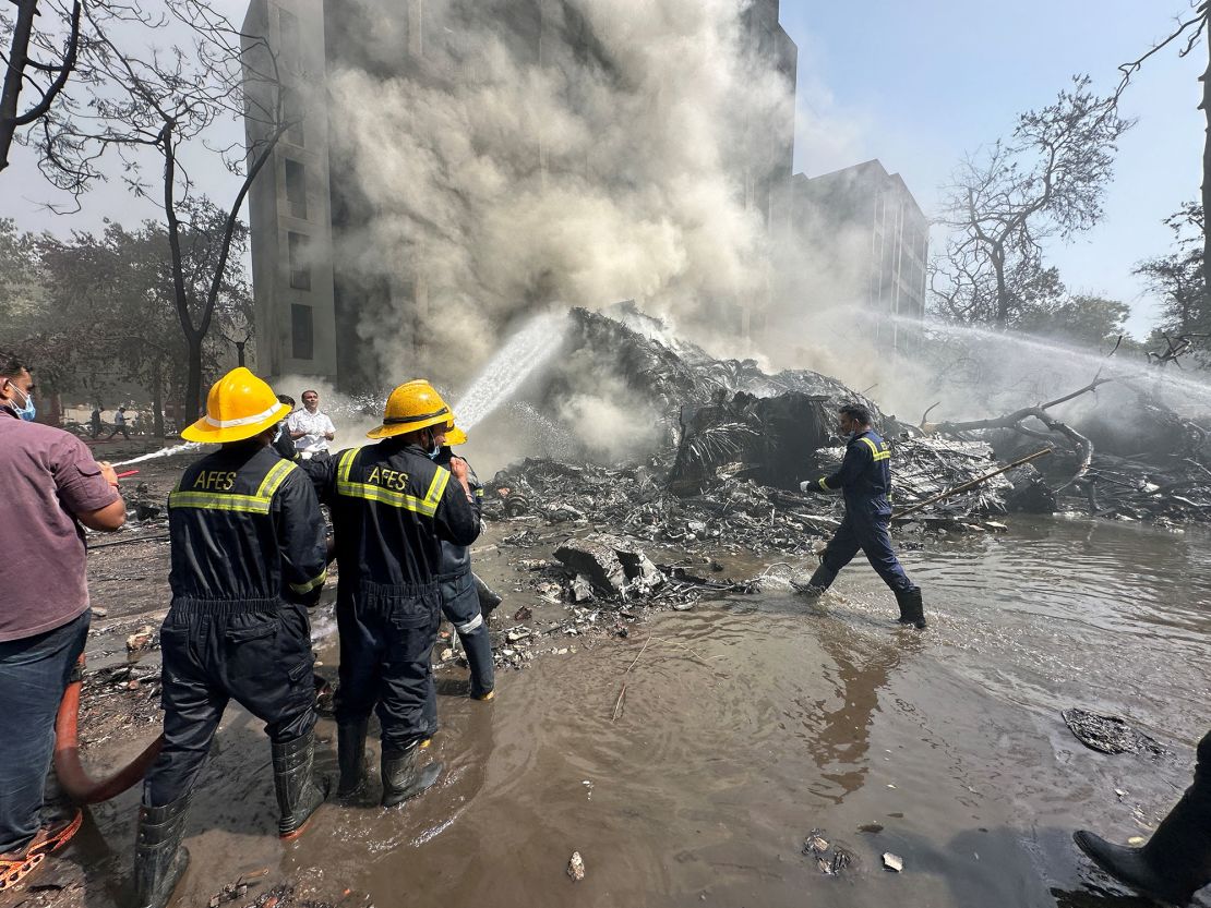 Rescue workers at the site where the Air India plane crashed.