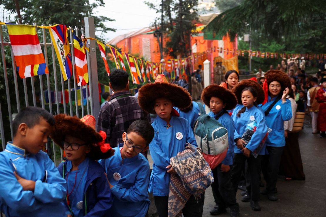 Students wait in line for the gates to open at the Tsuklakhang Tibetan Buddhist complex on Sunday.