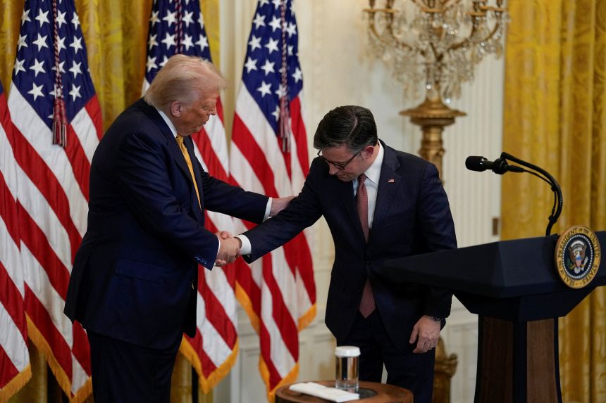 Speaker of the House Mike Johnson shakes hands with President Donald Trump during a dinner with Republican members of Congress, hosted at the White House on Tuesday.