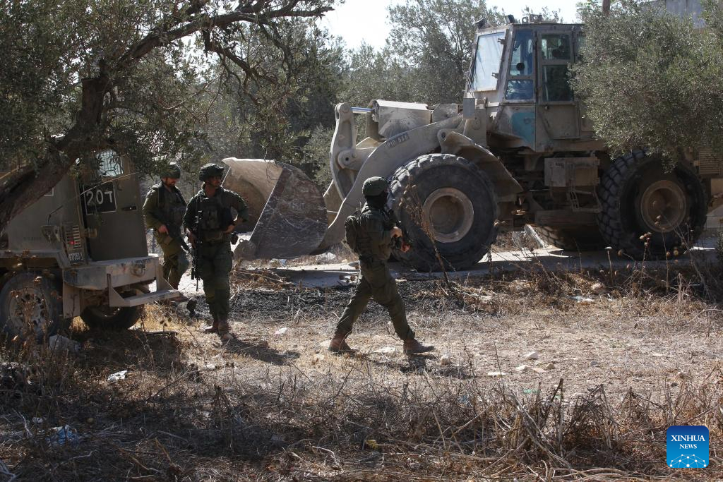 Members of Israeli forces carry out operation in Qabatiya town, West Bank-Xinhua
