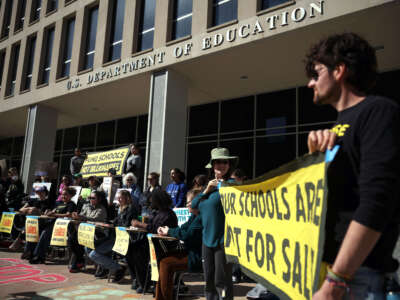 Protestors participate in the Rally to Defend Our Schools in front of the U.S. Department of Education on March 21, 2025, in Washington, D.C.