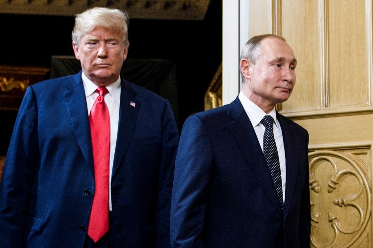 President Donald Trump and Russian President Vladimir Putin arrive for a meeting in Helsinki on July 16, 2018.