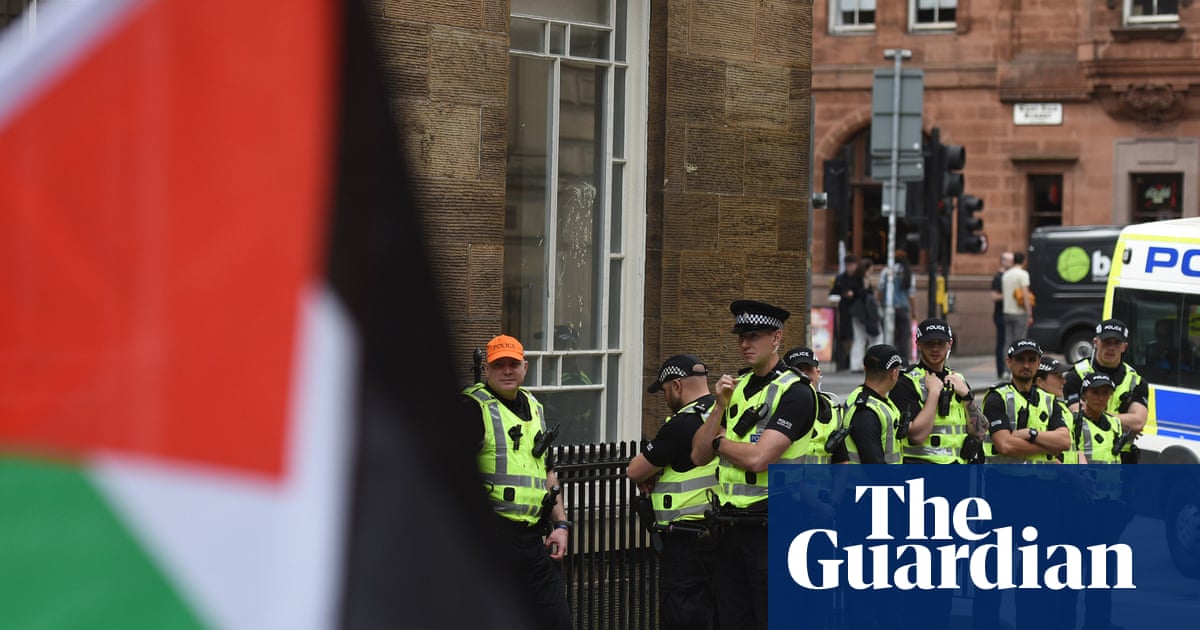 Man arrested in Glasgow for holding sign allegedly supportive of Palestine Action | UK news