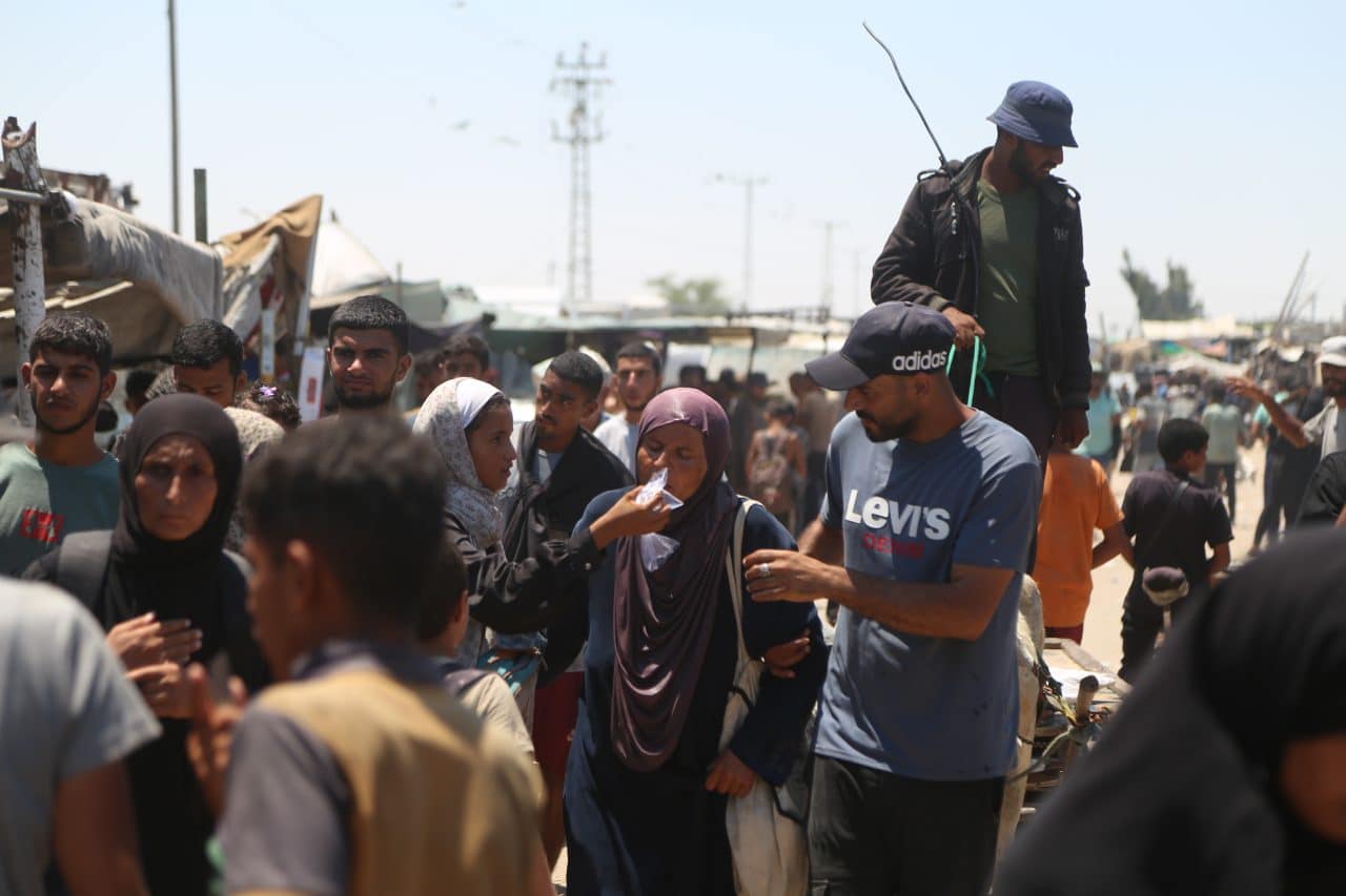 Palestinian women come back from GHF distribution center in southern Gaza, where eyewitnesses say GHF staff pepper-sprayed the aid-seekers and beat them with batons, July 24, 2025. (Photo: Abdallah Alattar/APA Images)