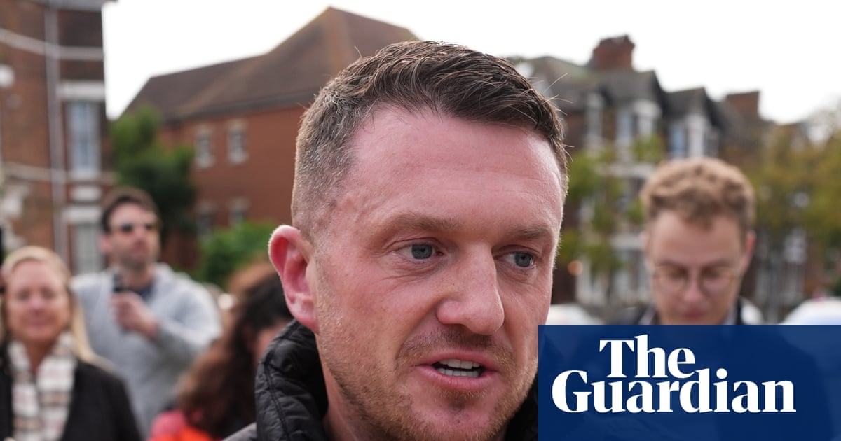 Tommy Robinson arrives in Tenerife as UK police investigate alleged assault | UK news
