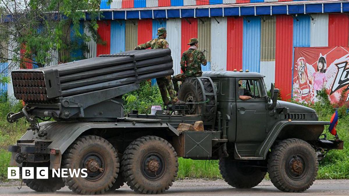 Cambodian soldiers tride a truck equipped with a Russian-made BM-21 rocket launcher in Cambodia's northern Oddar Meanchey province
