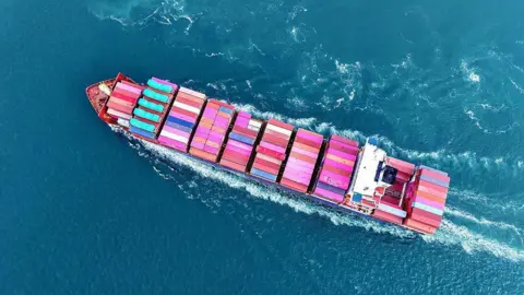 NurPhoto/Getty Images A cargo ship fully loaded with foreign trade containers leaves the port of Qingdao in Qingdao City, Shandong Province, China, on June 23, 2025