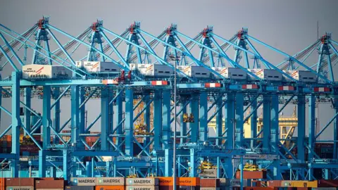 Bloomberg via Getty Images Ship-to-shore cranes at a container terminal at the Port of Rotterdam, in Rotterdam, Netherlands, on Monday, April 14, 2025