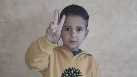 Family handout Iman al-Nouri's son, Amir