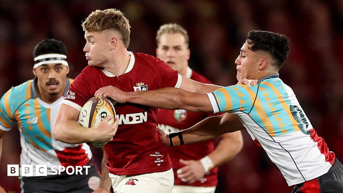 Sarina Wiegman looks forward with a fixed expression