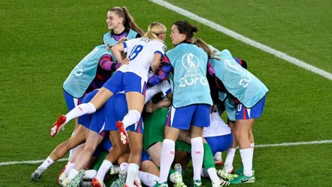 UEFA via Getty Images  England players celebrate after winning the penalty shoot
