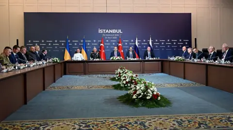 Getty Images Members of delegations from Ukraine, Russia and Turkey sat around a long c-shaped table during ceasefire talks