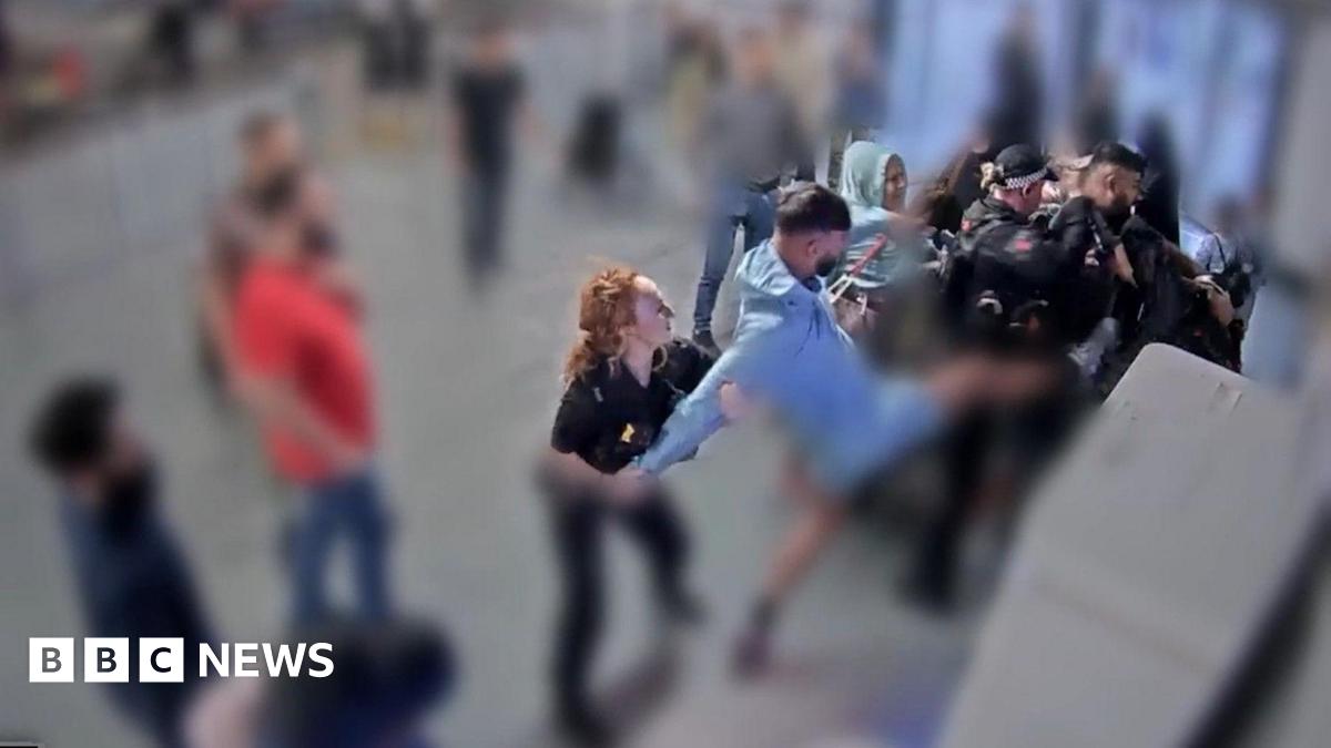 Mohammed Fahir Amaaz with black hair and beard and wearing a black suit arrives at Liverpool Crown Court.