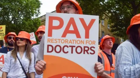 Getty Images Doctors on strike from previous walkout in dispute
