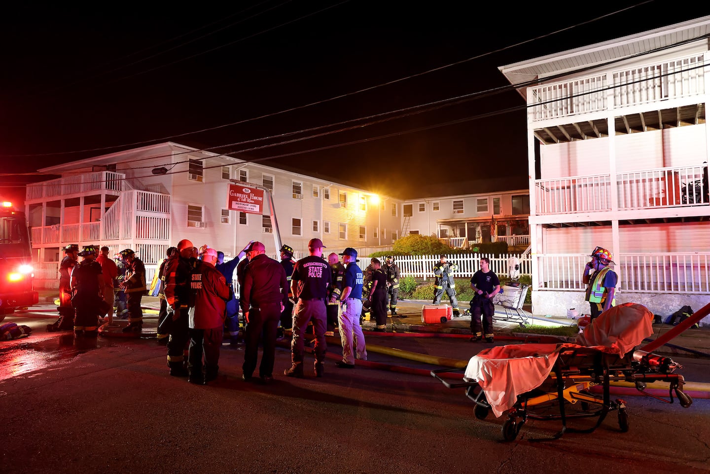 Firefighters from mutliple departments congregated outside of the Gabriel House Assisted Living facility on Oliver Street in Fall River, Mass., late Sunday night after a fire displaced several residents and caused injuries.