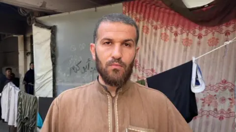 Mahmoud Abdul Rahman Ahmed speaks to the BBC in Nuseirat refugee camp after his son Abdullah was killed in an Israeli air strike that hit a water distribution point on 13 July 2025