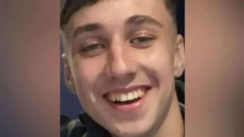 Family handout A photograph of Jay Slater, in close-up. He is smiling a the camera