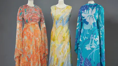 ROYAL COLLECTION TRUST Dresses from the 1970s with bright colours worn by the late Queen Elizabeth
