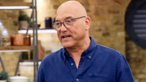 BBC Gregg Wallace on MasterChef, wearing a dark blue shirt