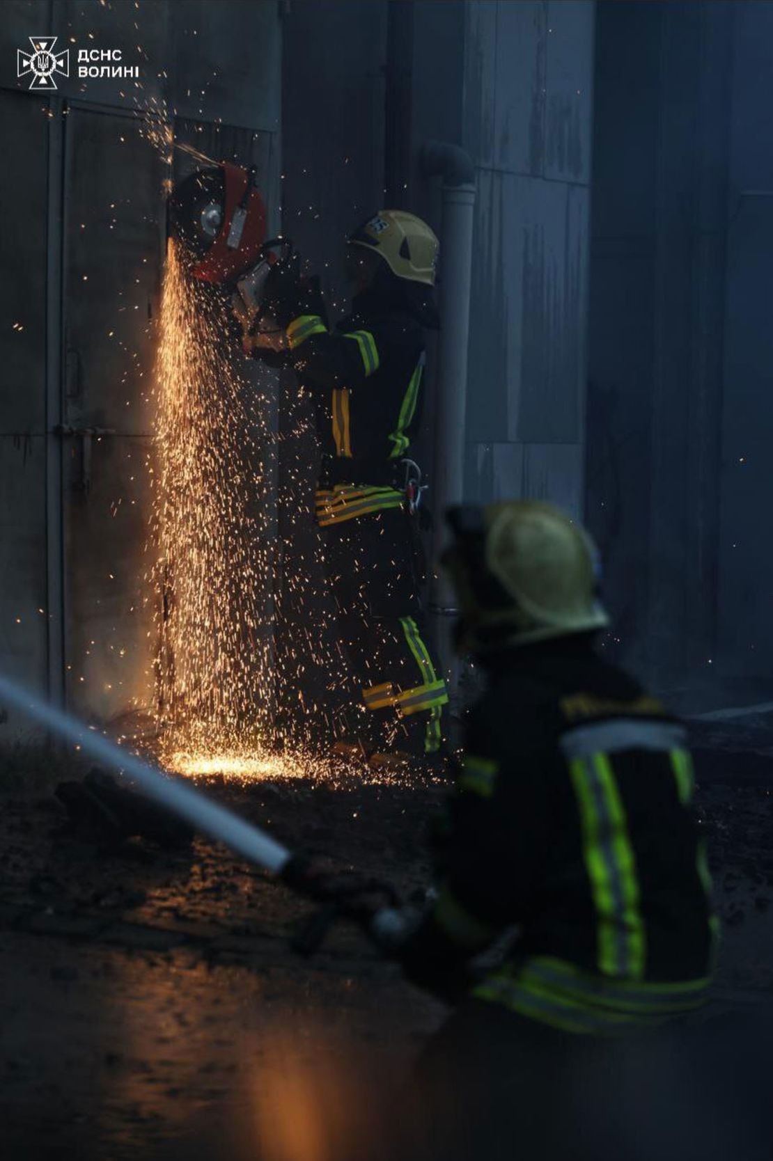 In this image shared to Telegram on July 9, 2025, firefighters work at the site of a Russian missile strike in Lutsk, Ukraine.