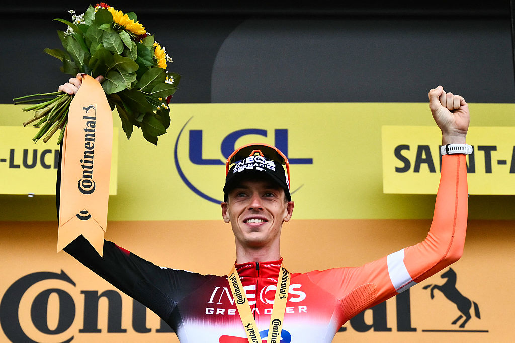 INEOS Grenadiers team's Dutch rider Thymen Arensman celebrates on the podium after winning the 14th stage of the 112th edition of the Tour de France cycling race, 182.6 km between Pau and Luchon-Superbagneres, in the Pyrenees mountains of southwestern France, on July 19, 2025. (Photo by Marco BERTORELLO / AFP)