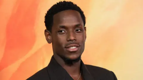 Reuters Micheal Ward at posing for photos at the Eddington premiere in June