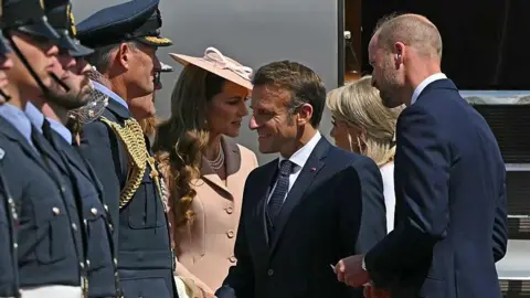 Getty Images France's President Emmanuel Macron and his wife Brigitte Macron  are greeted by Prince William, Prince of Wales and Catherine, Princess of Wales