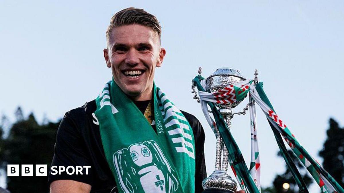 Sarina Wiegman looks forward with a fixed expression