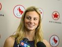 Olympic medalist Summer McIntosh speaks to members of the media after arriving at Pearson airport following the 2024 Paris Olympic Games, in Toronto, Monday, Aug. 12, 2024.