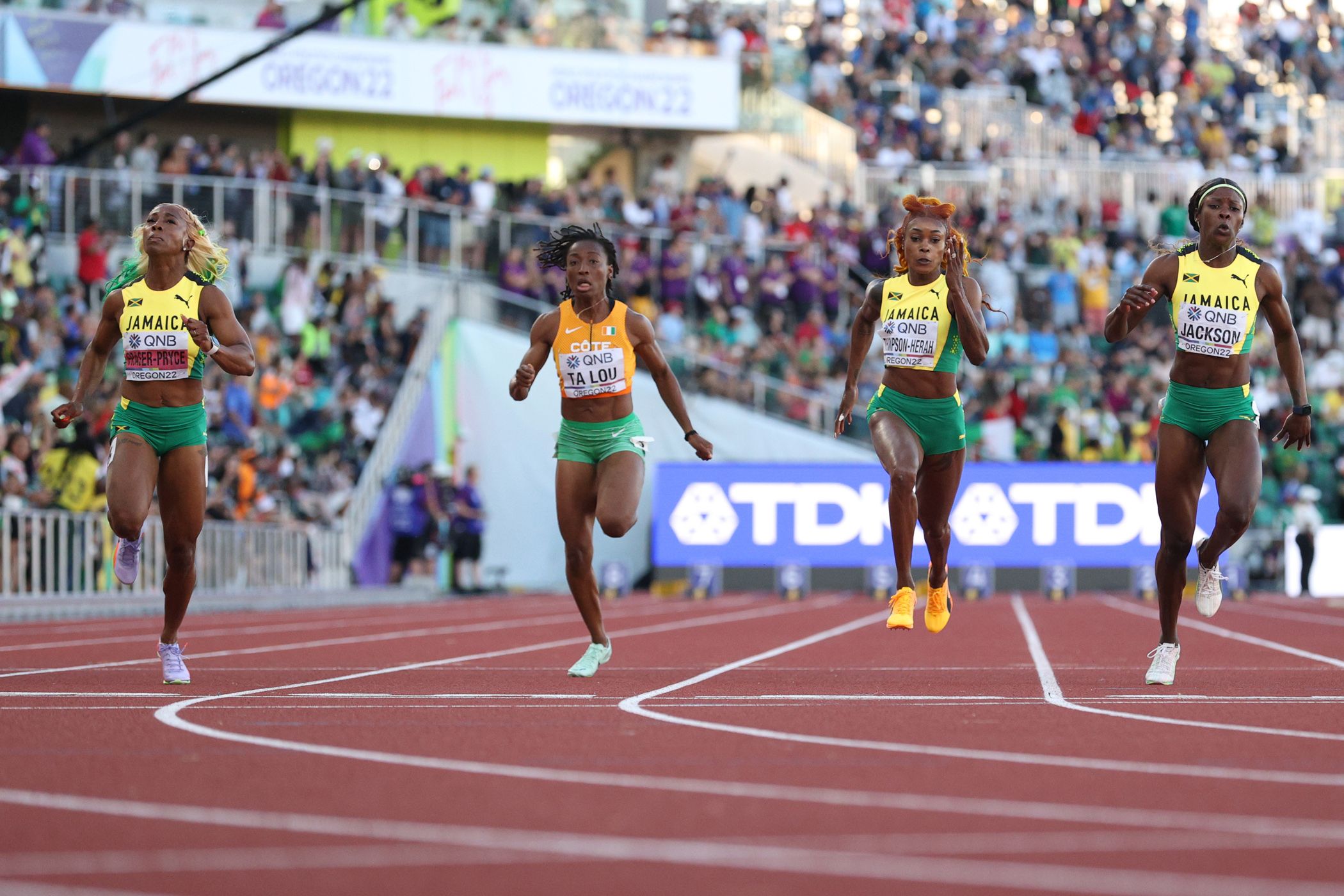 Shelly-Ann Fraser-Pryce (left) wins the 2022 world 100m title