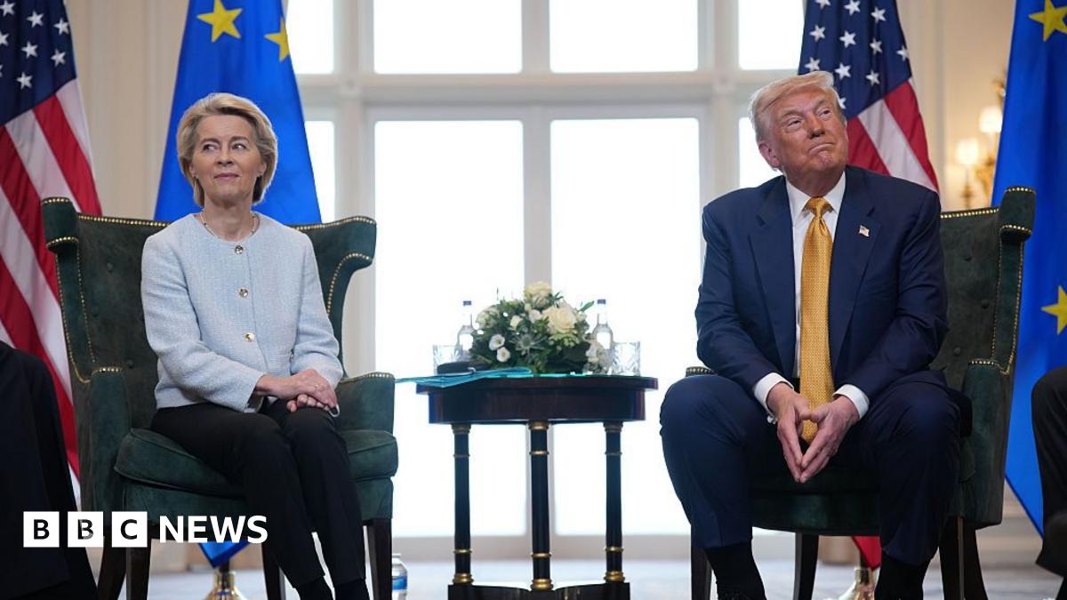 Ursula von der Leyen and President Donald Trump sitting on two green velvet chairs looking each in a different direction