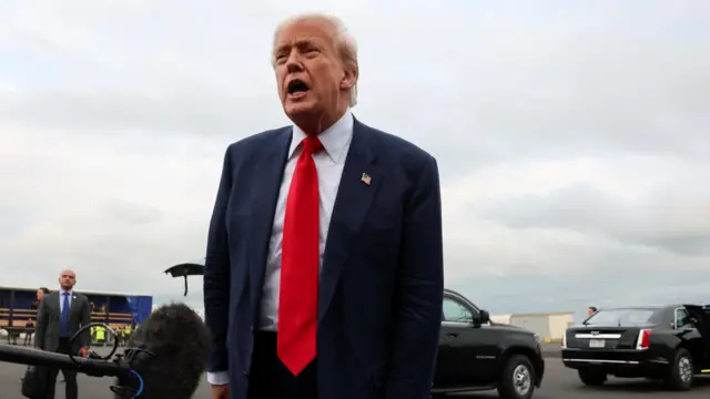 U.S. President Donald Trump speaks to members of the media on his arrival at Glasgow Prestwick Airport, in Prestwick, Scotland, Britain, July 25, 2025.