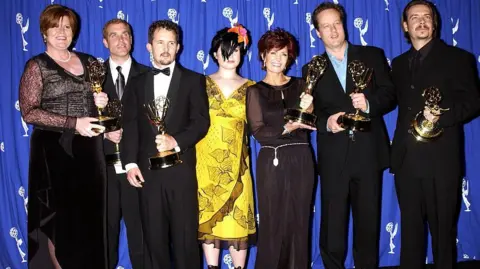 Getty Images The cast and crew of MTV's The Osbournes pose with their Emmy awards in 2002