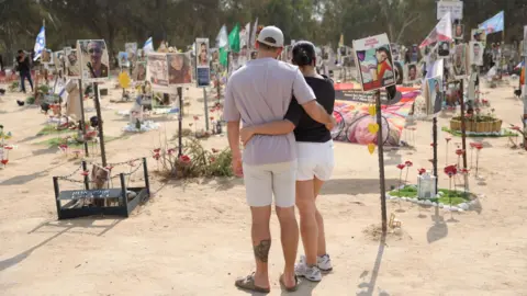 EPA File photo showing people visiting the memorial site for the victims of the 7 October 2023 attack on the Nova music festival, near Kibbutz Re'im, southern Israel (6 October 2024)