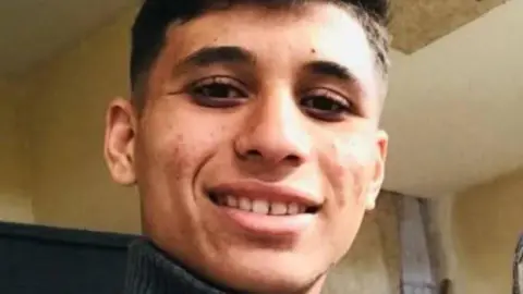 Family handout A young man, Abdullah Jendeia, smiles at the camera 