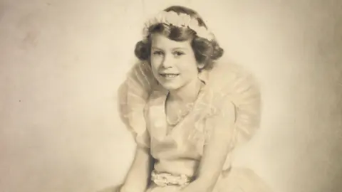 ROYAL COLLECTION TRUST Childhood photo of Queen Elizabeth II for exhibition of her fashion at Buckingham Palace in 2026