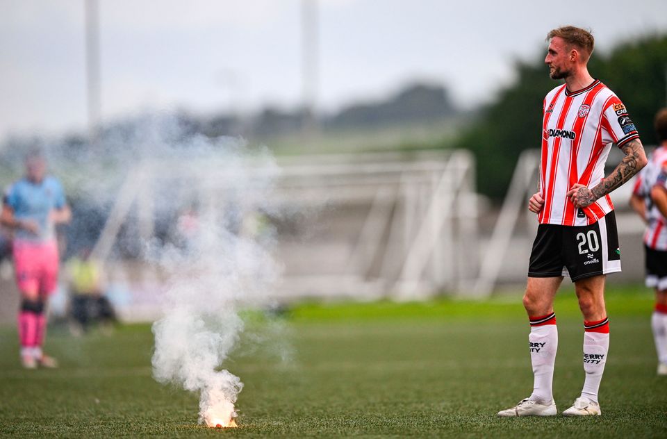 Carl Winchester of Derry City after a flare was thrown onto the pitch during the SSE Airtricity Men's Premier Division match between Derry City and Bohemians at The Ryan McBride Brandywell Stadium in Derry. Photo: Ramsey Cardy/Sportsfile