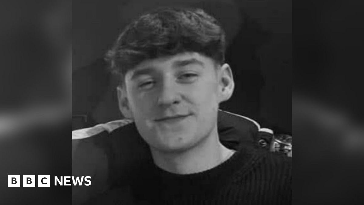 Bailey Chadwick in a black and white picture is smiling at the camera and has dark hair