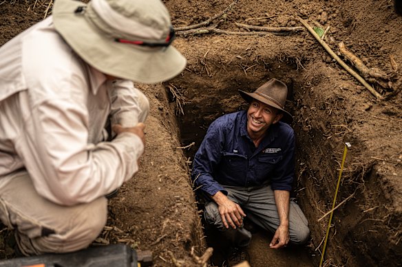 Associate Professor Tim Cohen, from the University of Wollongong, (right) and colleague Dr Daryl Lam, from Water Technology, confer as they study past flood sediment along the Nepean.