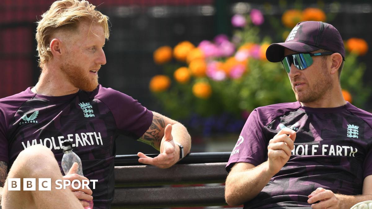 Sarina Wiegman looks forward with a fixed expression